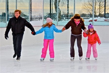 Family ice skating together